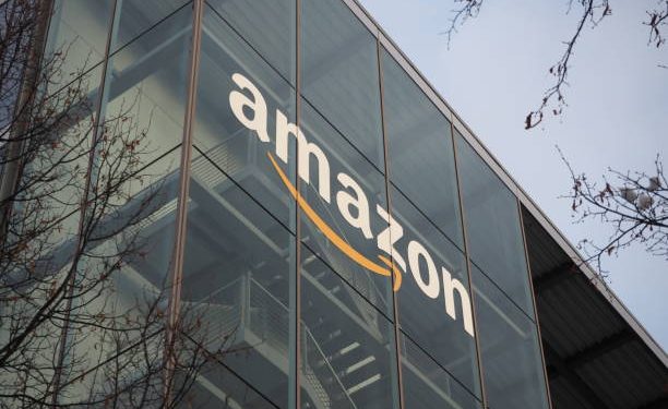 Munich, Bavaria Germany - December 11 2022: Amazon Deutschland Services GmbH e-commerce german headquarters office building with glass green trademark logo. Ultra HD