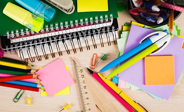 School and office accessories on wooden background